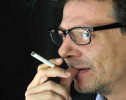 Alvaro Enrigue smoking